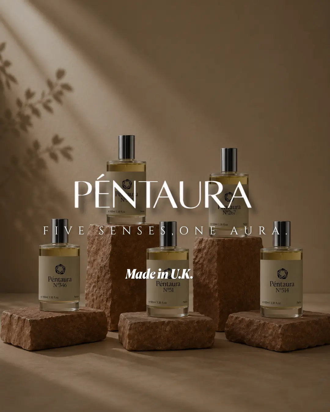 Five Pentaura fragrance bottles arranged on textured stone blocks against a warm beige background with soft leaf shadows. Large overlaid text reads 'PÉNTAURA', 'FIVE SENSES.