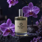 A bottle of Péntaura N°267 perfume with a beige label and silver cap, styled on a dark stone surface with purple orchids in the background.