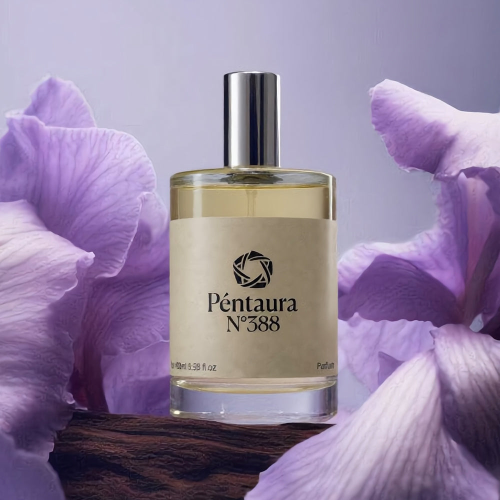 Pentaura No. 388 perfume bottle with a beige label and silver cap, set on a dark wooden surface and framed by large light purple flowers against a soft lavender background.